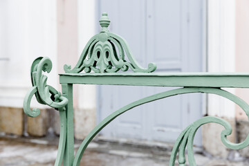 Green decoration design elements of an outdoor vintage forged railings