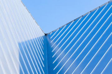 New roof corner made of stainless steel plates, abstract photo