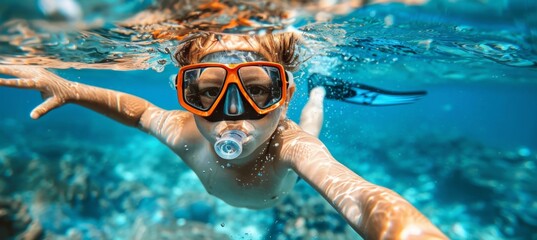 Adventurous youth snorkeling alone in crystal clear waters of a secluded tropical island