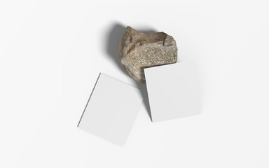 Blank polaroid photo frame with soft shadows and a stone