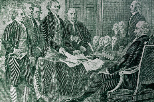The process of signing the US Declaration of Independence July 4, 1776 on a dollar bill
