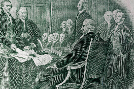 The process of signing the US Declaration of Independence July 4, 1776 on a dollar bill