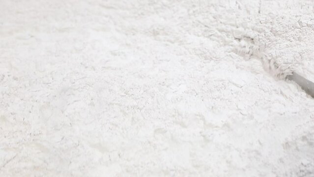 industrial powder medicine mixing and blending process close up. dusting powder chemical pharma ingredient in a large equipment production line in a pharma manufacturing plant factory