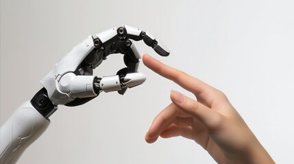 robotic hand touching finger to another finger of human hand over white background