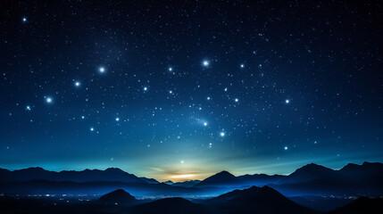Starry background as twilight descends on mountainous landscape