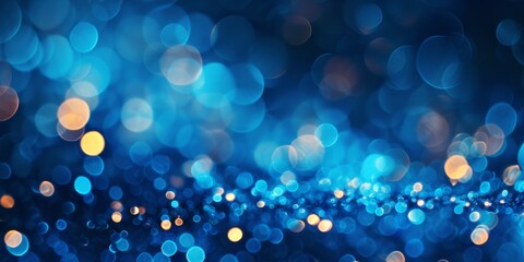 Blue and yellow blurred round light dots on dark blue abstract bokeh background