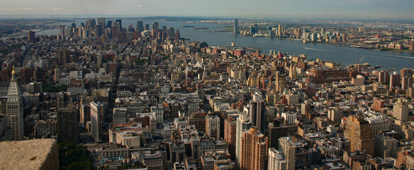 new york city background of highrises and skyscrapers backed by the hudson river and new york harbor - obrazy, fototapety, plakaty