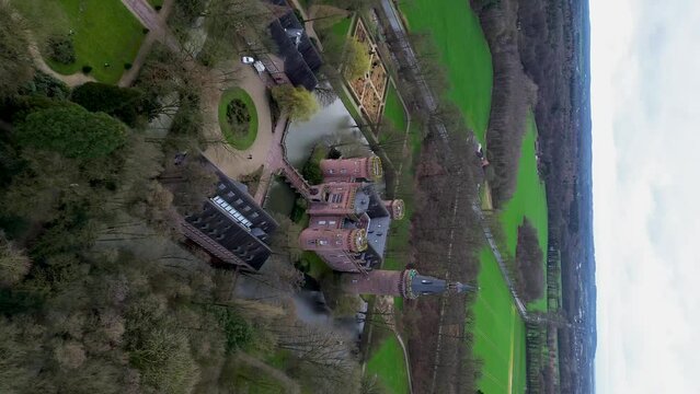 Moyland Castle near Kleve in the lower Rhine region. Beautiful view from above, from drone to orange, tiled roofs of houses.