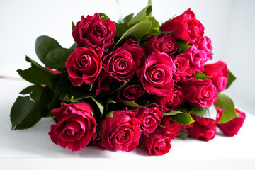 a bouquet of beautiful fresh red roses on a white background