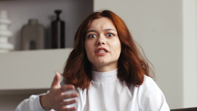 Webcam view portrait of angry woman boss video call work argue point face stress yelling anger hate speech. woman fight on videocall upset mad. Online job issue mental health burnout issues at office.