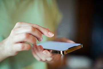 Close up of a young woman using a phone