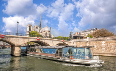Paris, Notre Dame cathedral with boat on Seine in France - 762658125