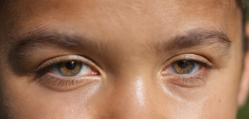 Close-up face of a teenager, dark hair, eyes, evil eye, revenge - obrazy, fototapety, plakaty