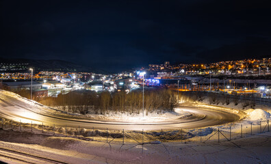 Narvik, Norway - February 24, 2024: Scenic winter view of the city of Narvik, northern Norway by night.