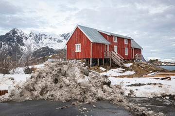 Traditional red Norwegian fishermans´ house on Lofoten islands in winter