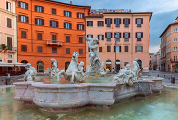 The famous fountains with tritons in Piazza Navona in Rome at dawn. - 762671572