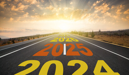 The years 2024 to 2028 are written on the empty asphalt road. 2025 New Year future vision concept .  New year 2025 begins