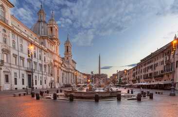 The famous fountains with tritons in Piazza Navona in Rome at dawn. - 762672537