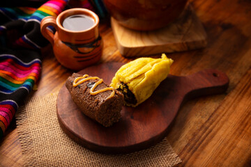 Chocolate Tamale. hispanic dish typical of Mexico and some Latin American countries. Corn dough wrapped in corn leaves. The tamales are steamed. Usually accompanied with atole, hot chocolate or coffee - 762675925