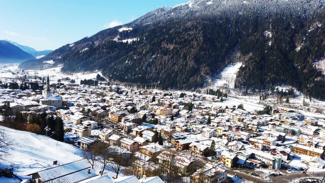 Aerial view snowy little village Pinzolo Trentino Alto Adige Dolomites Italy in winter