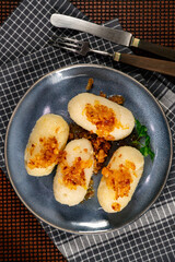 Kartacze - potato dumplings stuffed with minced meat. Shallow depth of field.
