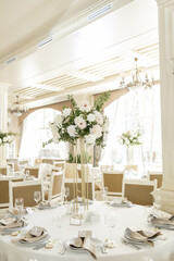 Elegant wedding reception venue with sophisticated decor and floral arrangements