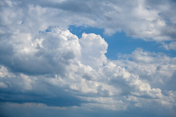 blue sky with grey white clouds, sky scenery, sunlit clouds