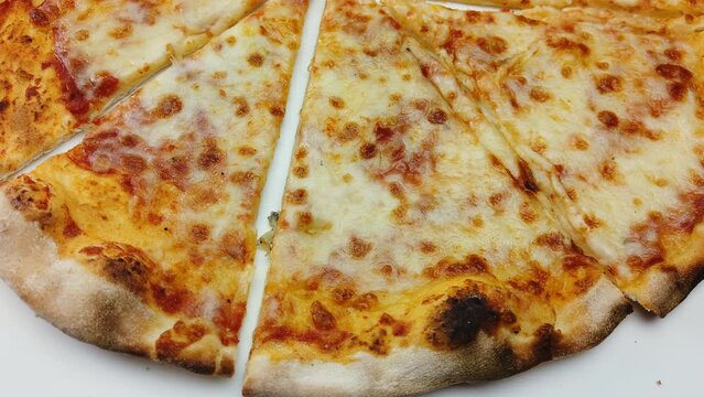 pizza italian margherita slices closeup rotating