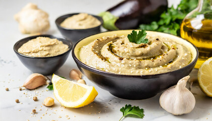 Arab Cuisine - Baba Ganoush (smoky eggplant dip made with tahini, garlic, lemon juice, and olive...