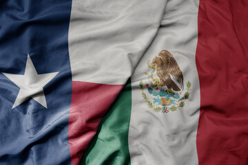 big waving realistic national colorful flag of texas state and national flag of mexico .