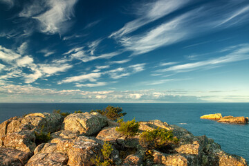 Beautiful coastal scenery in Tasmania: Cliffs and turquoise waters merge, framed by rugged...