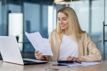 Professional woman working at her desk with laptop