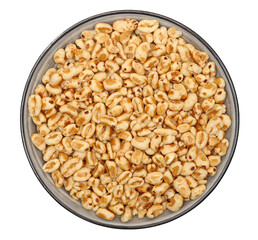 Puffed wheat cereal flakes with honey in bowl isolated on white, top view
