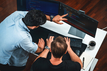 IT developers discussing online software development information on pc screen, creating program...