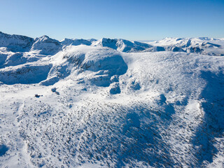 Fototapeta na wymiar Aerial Winter view of Rila mountain near Musala peak, Bulgaria