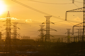 Electrical substation on the sunset background. Power substation and power lines on the background...