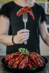 cooked crayfish impaled on a fork