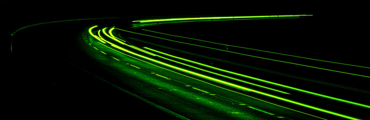 green car lights at night. long exposure