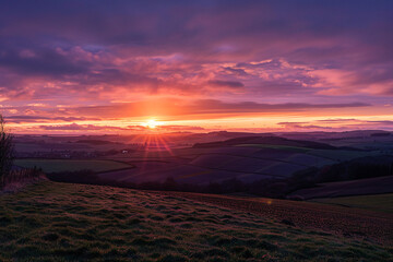 A stunning sunset over a tranquil countryside casting