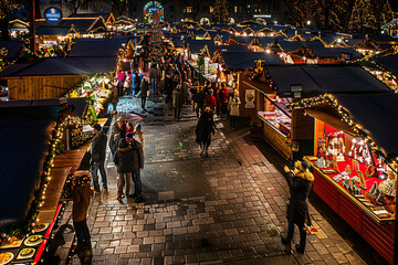 A panoramic view of a Christmas market filled 