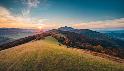colorful sunset in the mountains of the little carpathians in slovakia at autumn evening discover the mountains from drone - obrazy, fototapety, plakaty