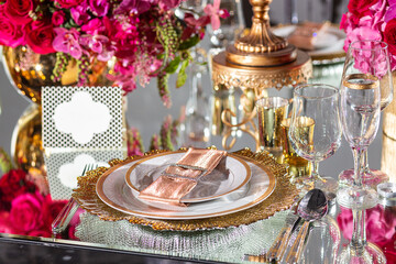 Elegant event table setting gold white magenta red
