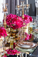 Elegant event table setting gold white magenta red
