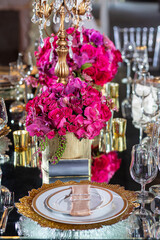 Elegant event table setting gold white magenta red
