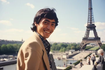 Fotobehang Asian man smiling at Eiffel Tower in Paris in 1970s © blvdone