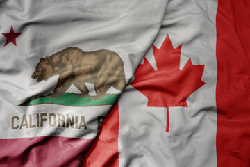 big waving realistic national colorful flag of california state and national flag of canada .