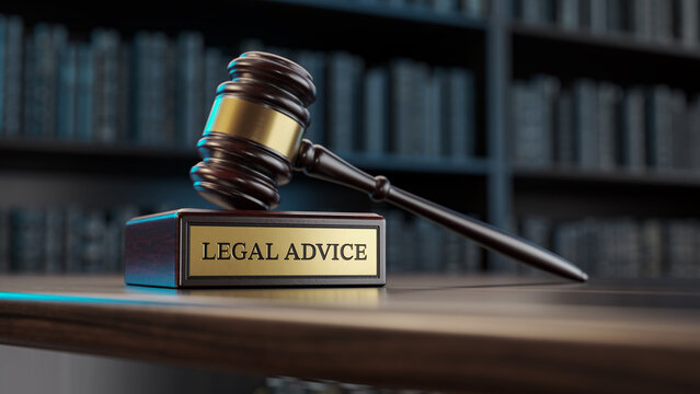 Legal advice:: Judge's Gavel and wooden stand with text word on the background of books
