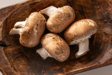 Baby Portobello Mushrooms in a Wood Bowl - 762757393