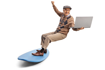 Elderly man on a surfboard holding a laptop computer