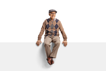 Man pensioner sitting on a blank banner